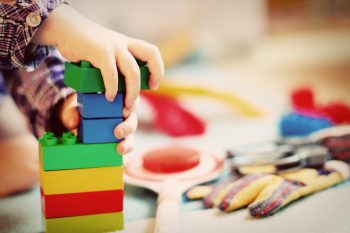 A child playing with Lego.