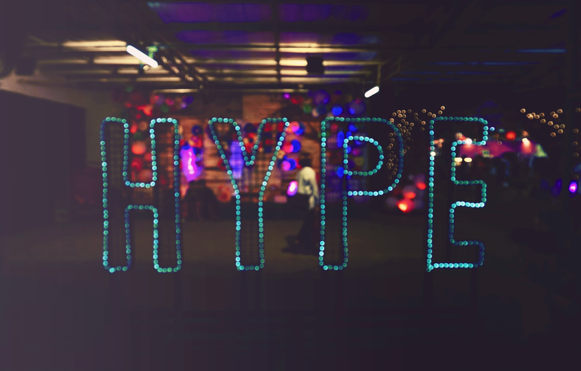 A sign lit up to spell 'hype'