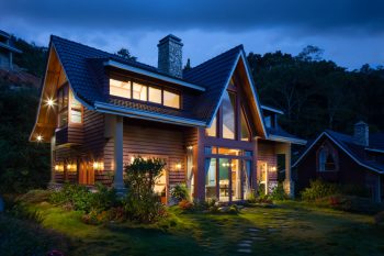 A house lit up in the evening.